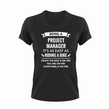 Load image into Gallery viewer, Being A Project Manager It's As Easy As Riding A Bike Funny T-Shirtbike, funny, Ladies, Mens, project manager, Unisex