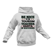 Load image into Gallery viewer, Be Nice to the Tourism Teacher Santa is Watching Hoodie