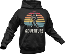 Load image into Gallery viewer, Guy hiking with adventure text printed on a black hoodie