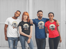 Load image into Gallery viewer, Astronaut riding a skateboard through space printed on a group of friends coloured t-shirts