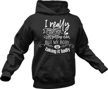 Load image into Gallery viewer, I really don't mind getting older but my body is taking it badly Hoodie