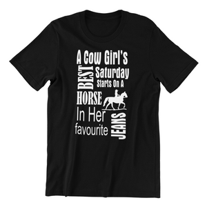 A cow girl's best Saturday starts on a horse in her favorite jeans T-shirt