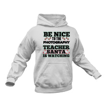 Load image into Gallery viewer, Be Nice to the Photography Teacher Santa is Watching Hoodie
