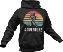 Load image into Gallery viewer, Guy hiking with adventure text printed on a black hoodie

