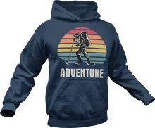 Load image into Gallery viewer, Guy hiking with adventure text printed on a blue hoodie
