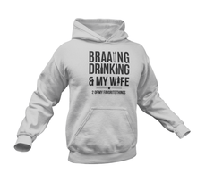Load image into Gallery viewer, Braaing Drinking And My Wife Hoodie
