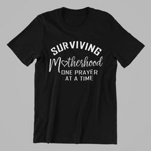 Load image into Gallery viewer, Surviving Motherhood One Prayer at a Time T-shirtaunt, christian, family, funny, girl, Ladies, mom, neice, sister, Unisex
