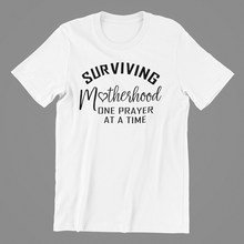 Load image into Gallery viewer, Surviving Motherhood One Prayer at a Time T-shirtaunt, christian, family, funny, girl, Ladies, mom, neice, sister, Unisex
